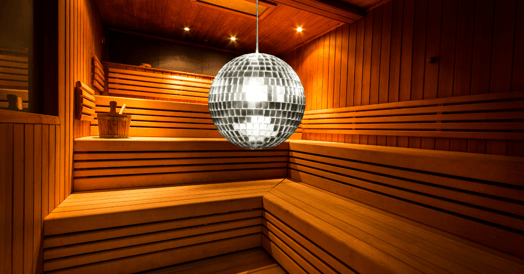 A disco ball hangs in a sauna.